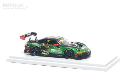 Model car on a white stand with a white background
