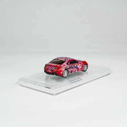 A red toy car with cartoon designs, featuring pink characters and checkerboard patterns, displayed on a clear stand against a simple white background.