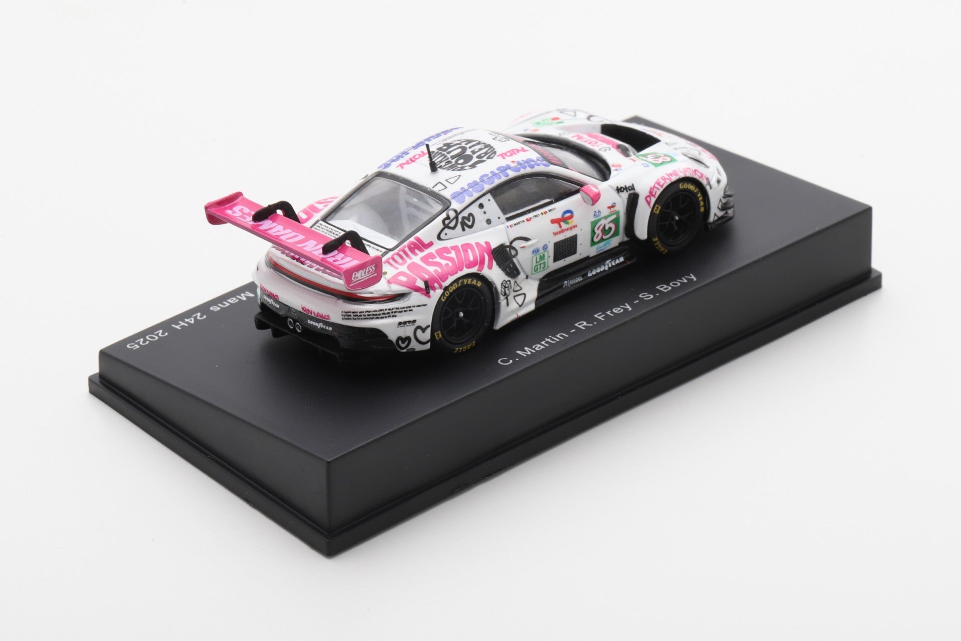 Model car on a black display stand with a white background