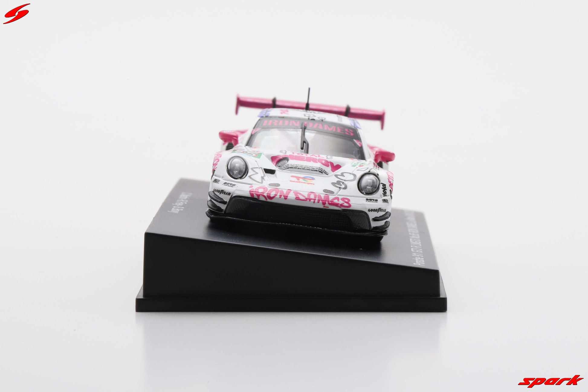 Model race car on a black base with 'Spark' branding