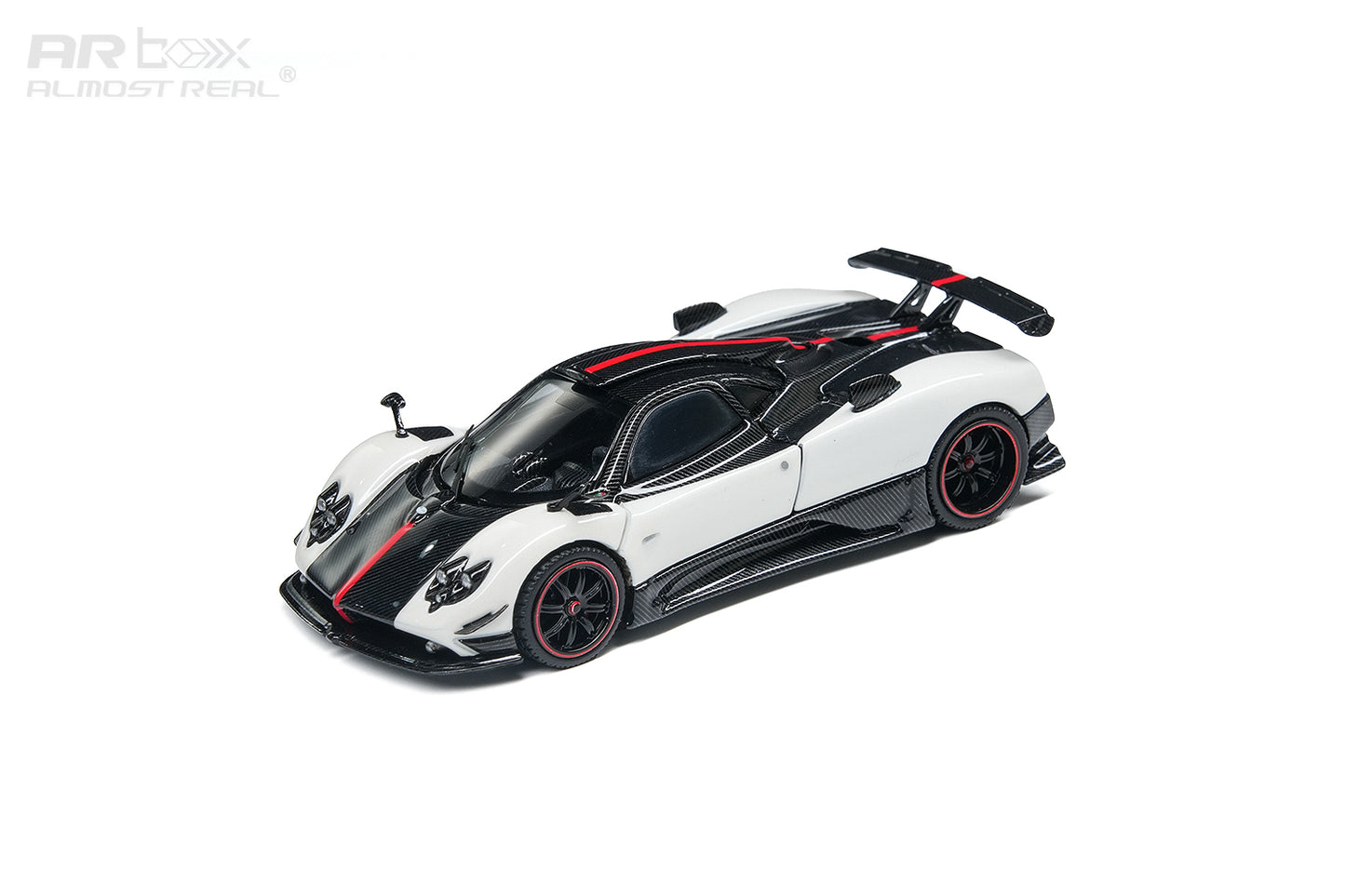 A white and black Pagani Zonda R1 scale model car with red accents, featuring an open driver-side door and rear spoiler, shown on a clean white background with an ARbox watermark.