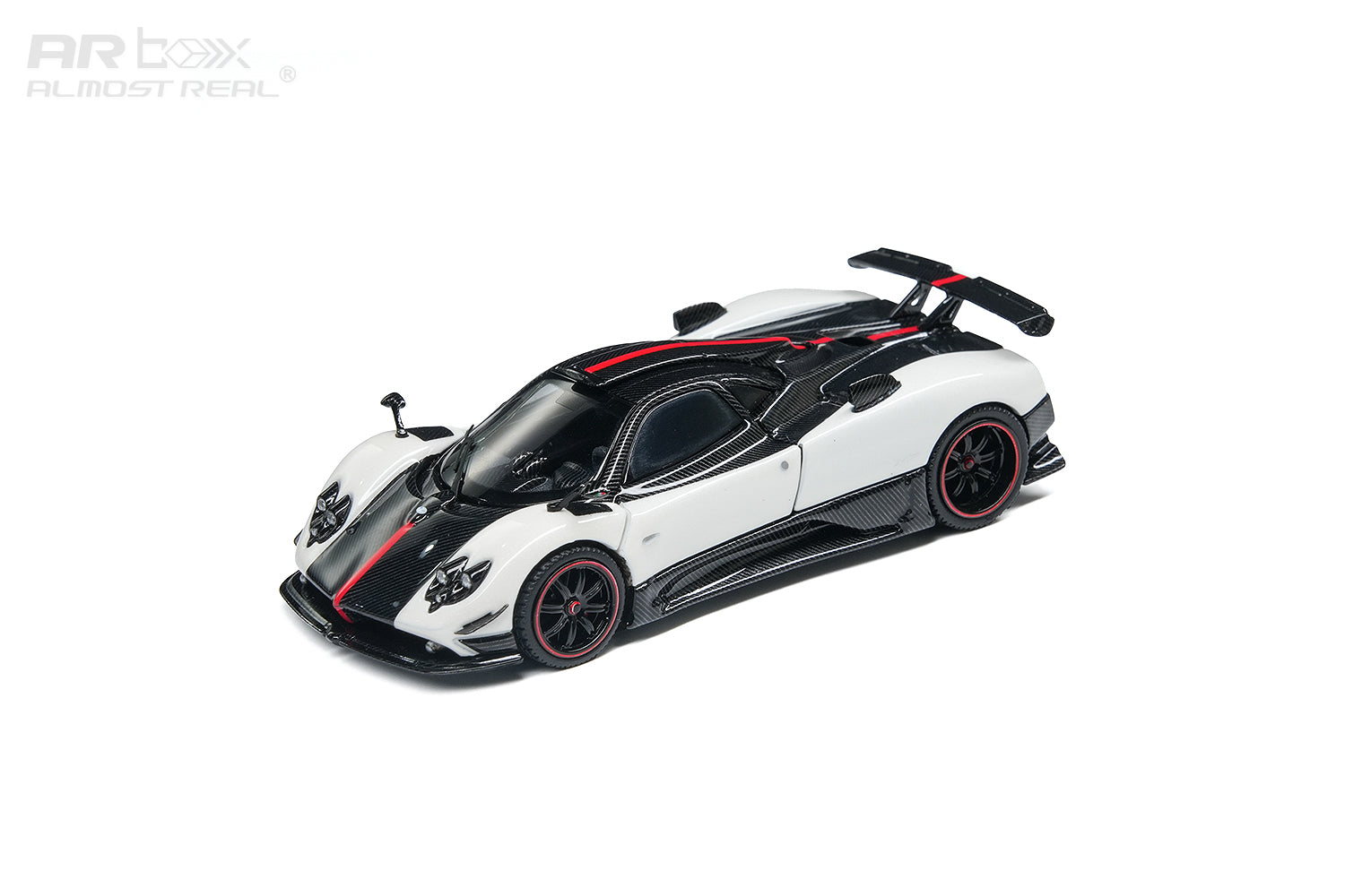 A white and black Pagani Zonda R1 scale model car with red accents, featuring an open driver-side door and rear spoiler, shown on a clean white background with an ARbox watermark.