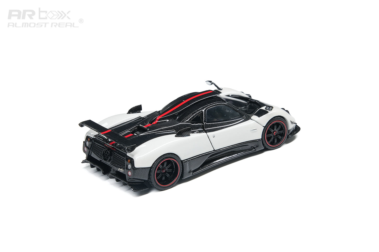 A white and black Pagani Zonda model car with red accents, shown from a rear three-quarter angle on a clean white background with an ARbox watermark.