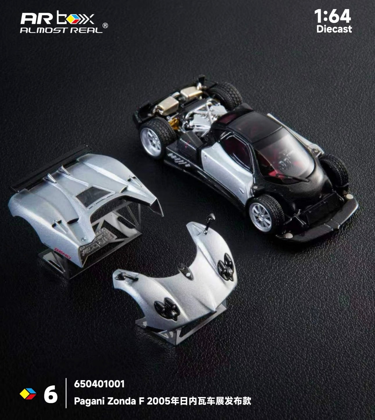Diecast model of a Pagani Zonda F displayed with removable silver body panels. The intricate details highlight the luxury sports car's design.