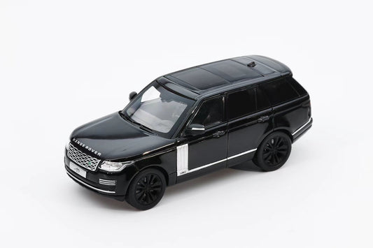 Black Land Rover model car on a white background