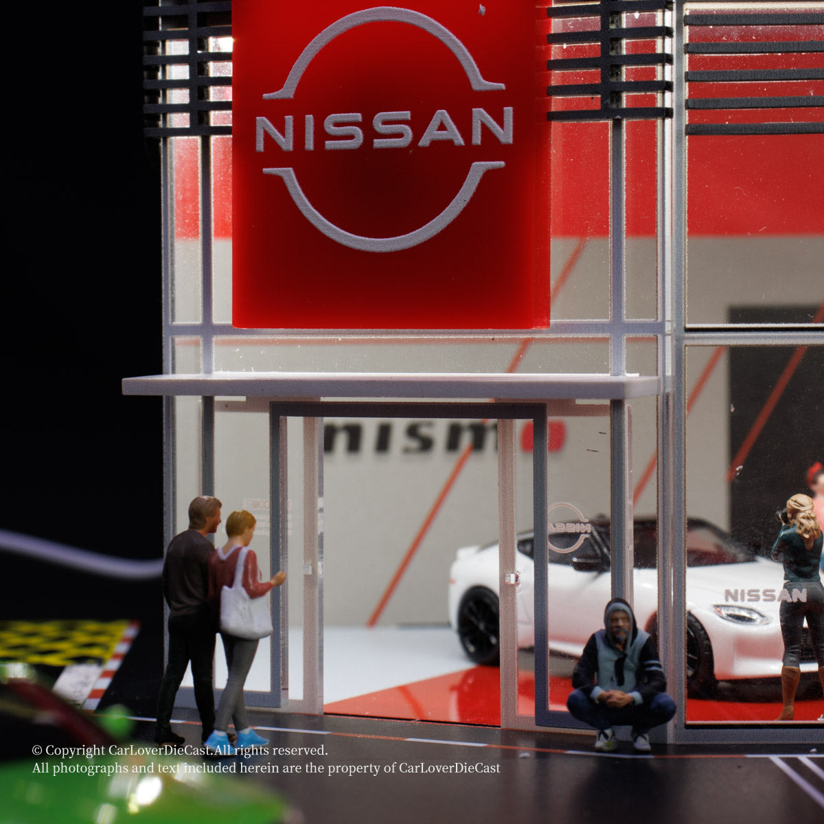 Nissan display with people interacting in a showroom setting