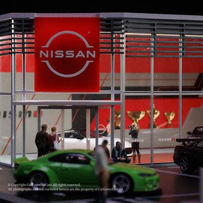 Nissan showroom with a green car in the foreground and people around.