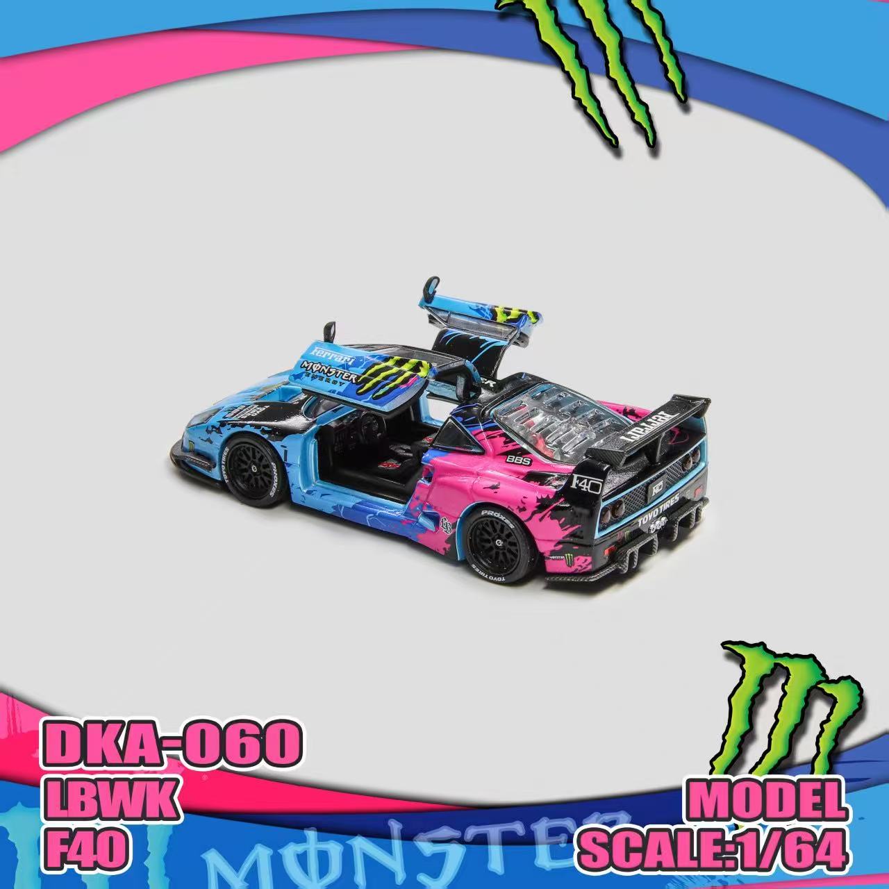 Colorful model car with open doors on a white background, featuring Monster Energy branding.