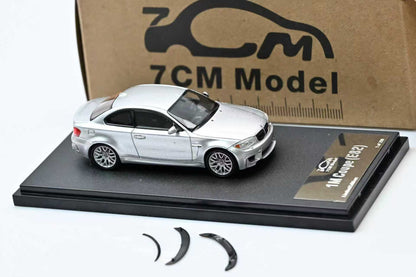 Model car on a display stand with '7CM Model' branding in the background