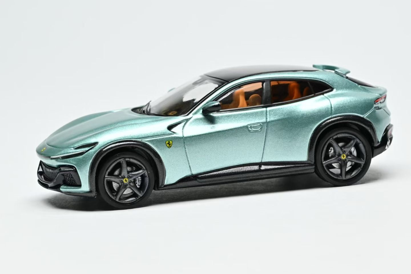 Model of a green sports car on a white background