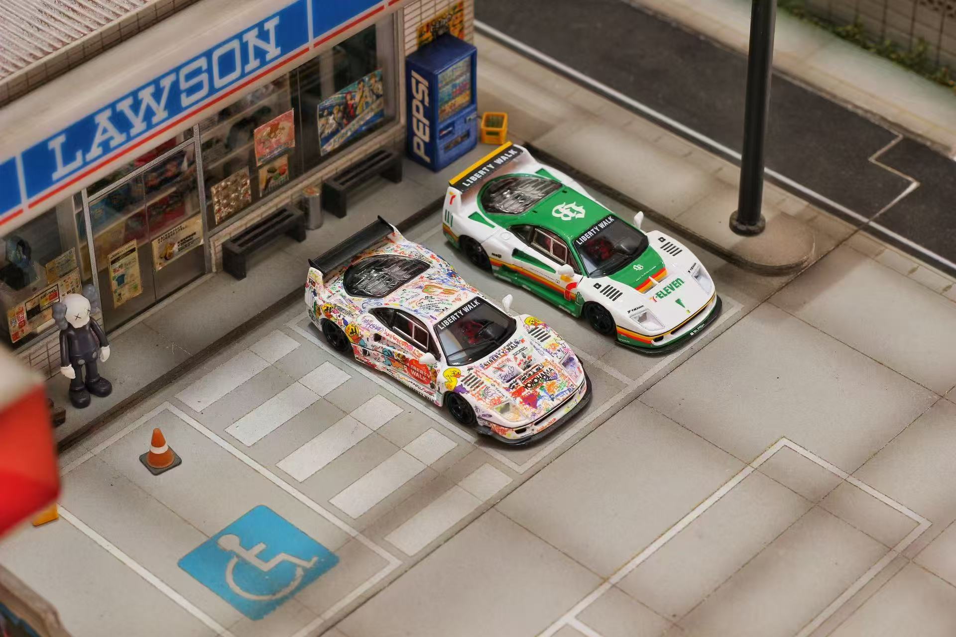 Model cars on a miniature street with a Lawson store in the background