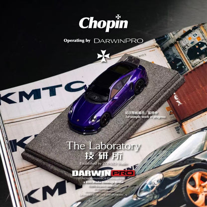 Purple toy car on a magazine with 'Chopin' and 'DarwinPro' branding.