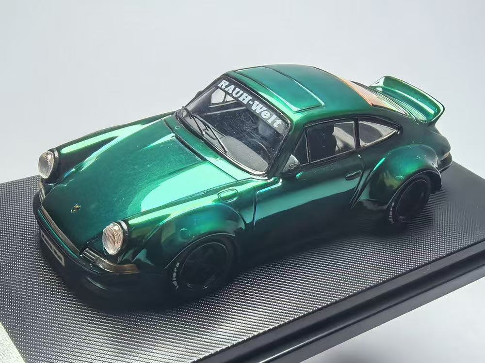 Model car with a shiny green finish on a gray background