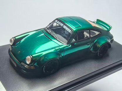 Model car with a shiny green finish on a gray background