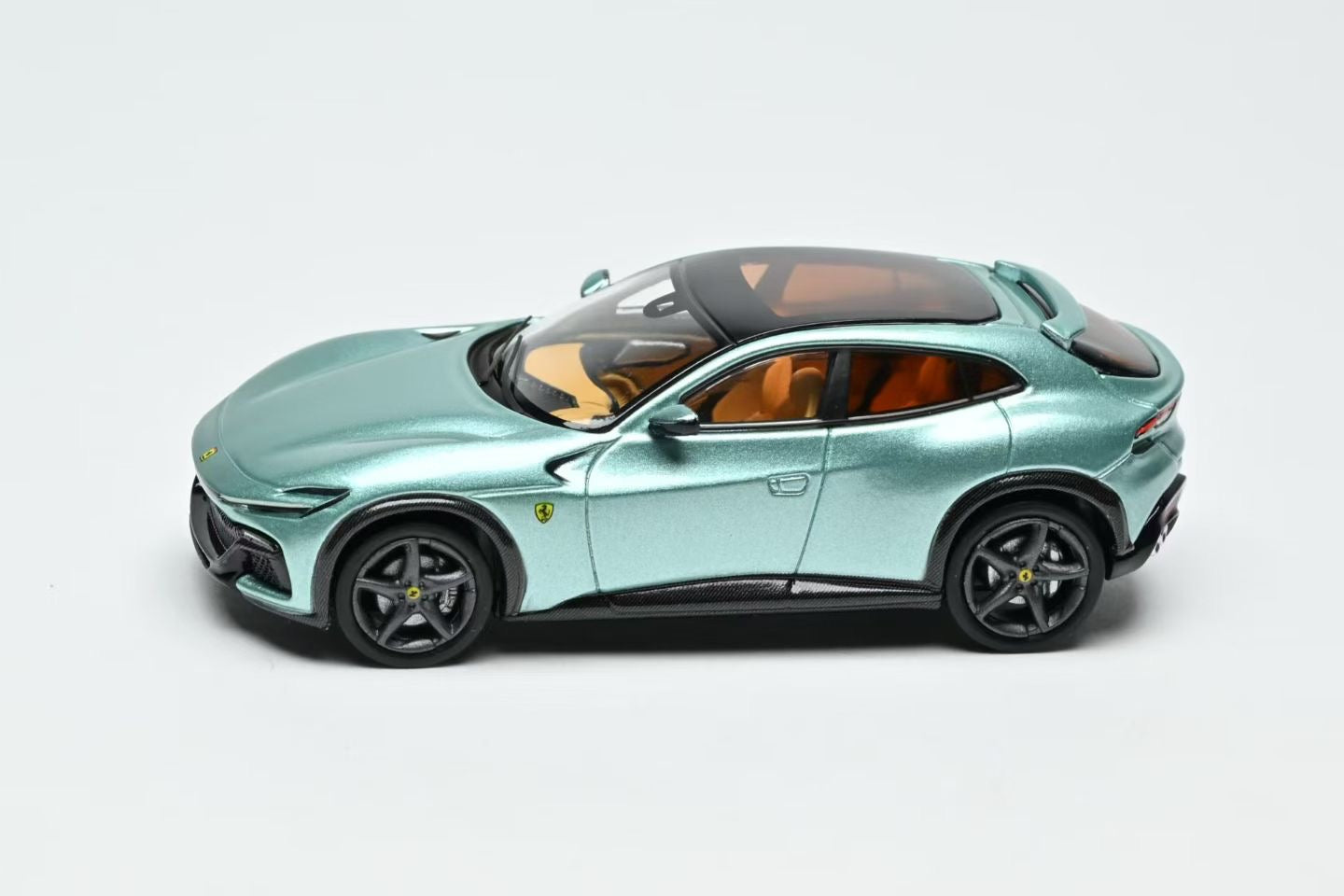 Model of a green sports car on a white background