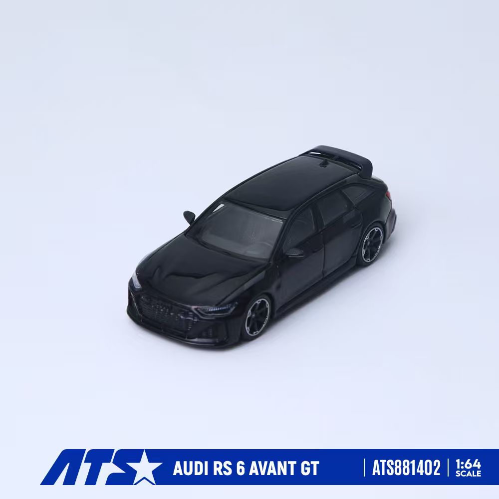 A black 1:64 scale diecast model car of the Audi RS 6 Avant GT, shown from a three-quarters front angle on a light gray background with an ATS brand banner at the bottom.