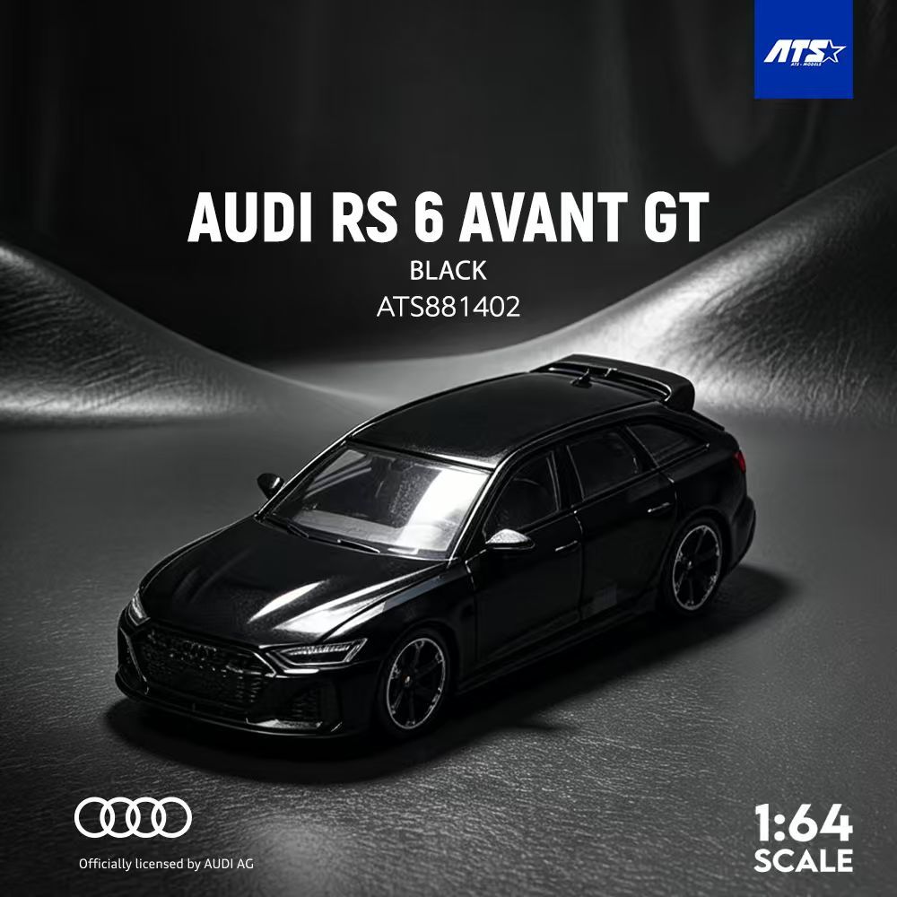 A black 1:64 scale model car of the Audi RS 6 Avant GT, shown on a dark textured surface with dramatic lighting. The image includes branding for ATS and an official license by Audi AG.