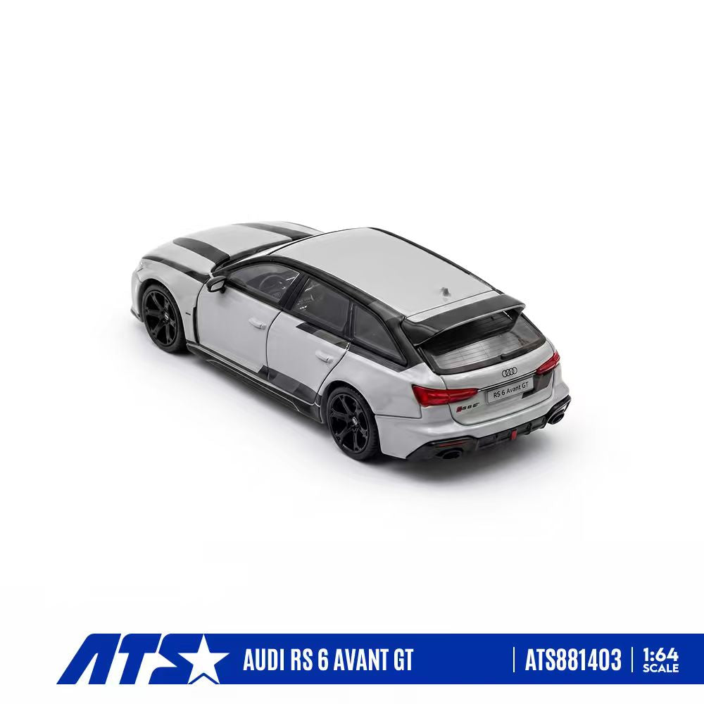 A 1:64 scale model of an Audi RS 6 Avant GT in metallic silver with black accents, shown from a three-quarters rear angle on a white background with an ATS brand banner at the bottom.
