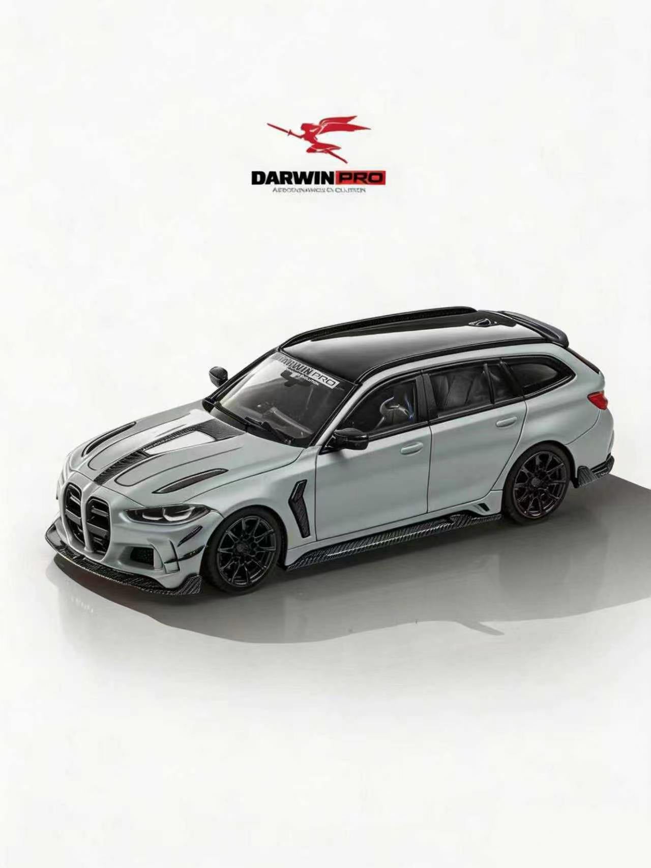 Model car of a BMW with Darwin Pro logo on a white background