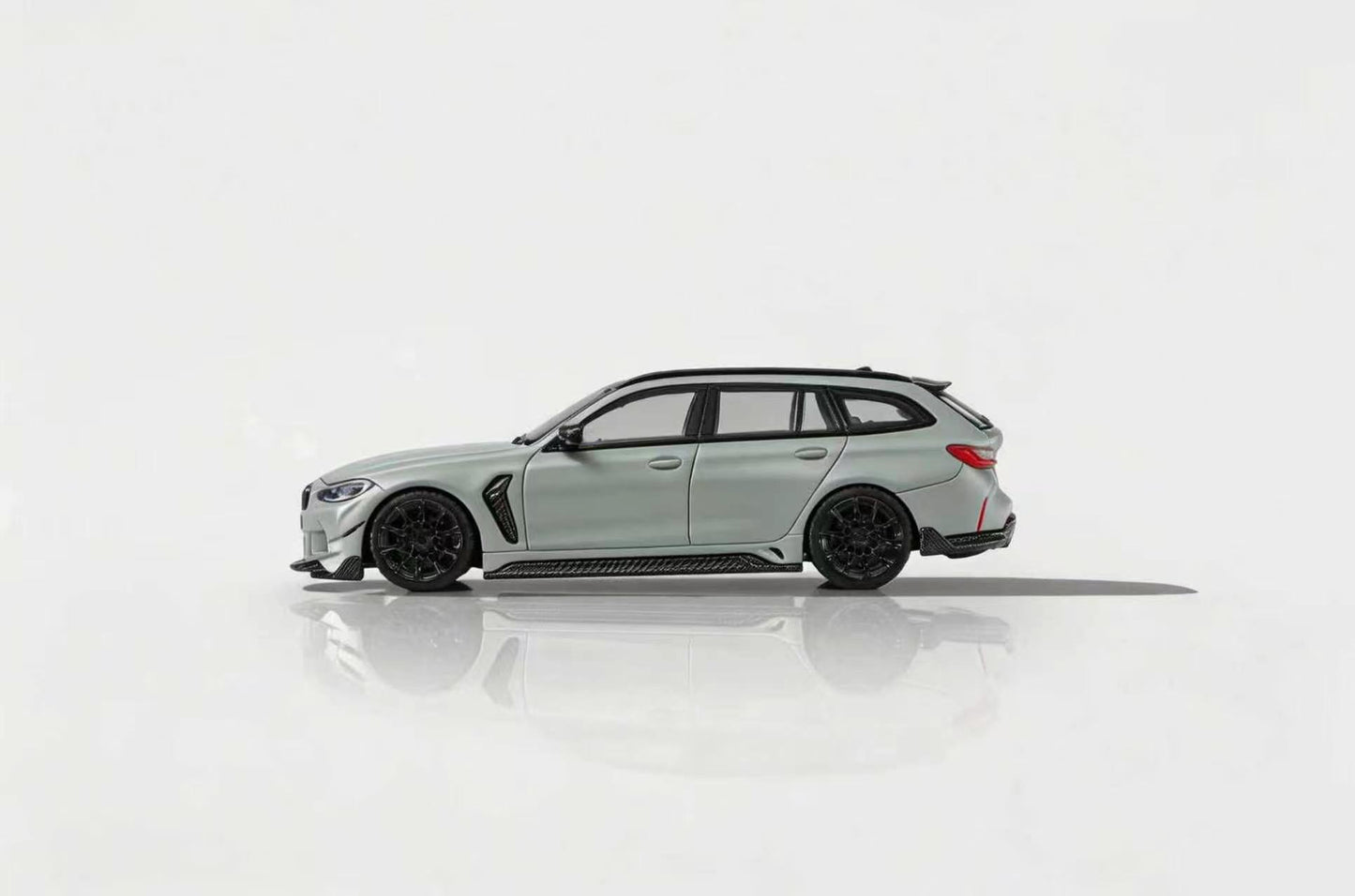 Side view of a light gray car on a white background