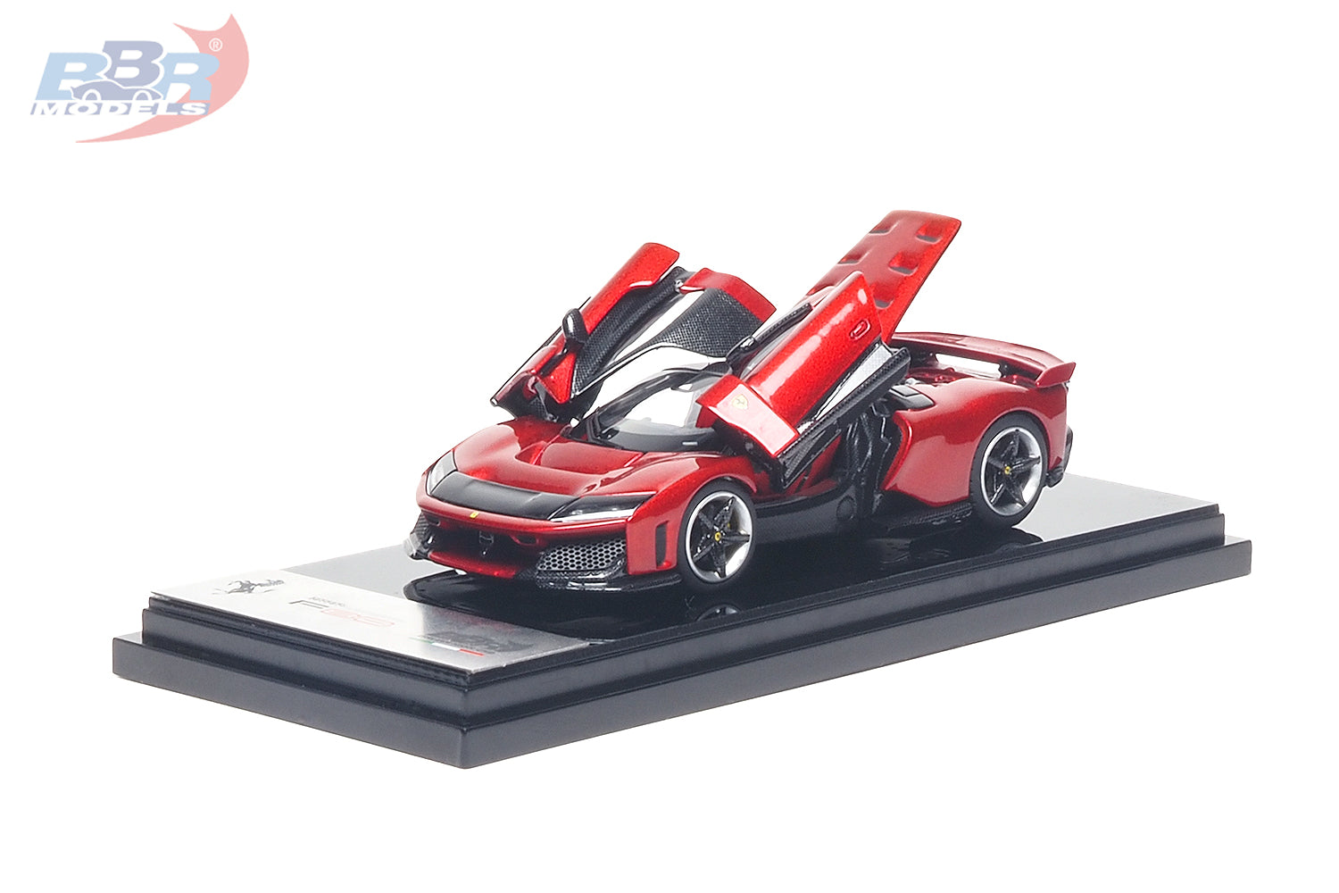 1:64 scale Ferrari F80 diecast model in Rosso Corsa red displayed on a premium presentation base with both butterfly doors fully opened, revealing a detailed black interior. Features carbon fiber accents, aerodynamic styling, realistic wheels, and an opening-door design, making it a premium collectible for Ferrari enthusiasts and diecast model collectors