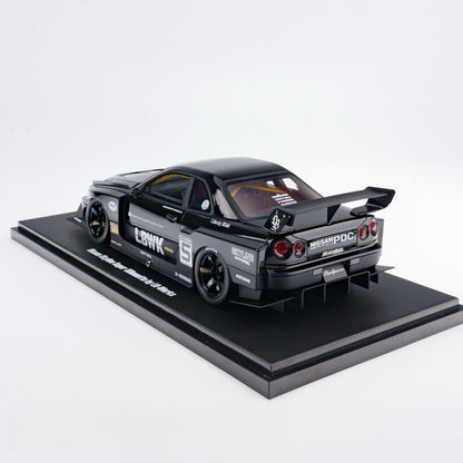 Model car on a black platform with a white background