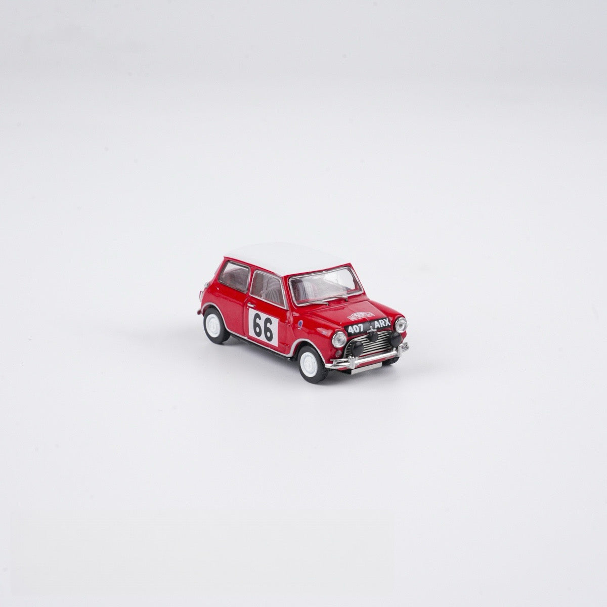 Red toy car with the number 66 on a white background