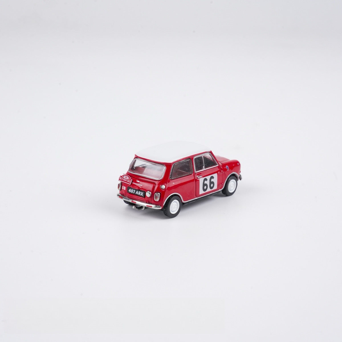 Red model car with the number 66 on a white background