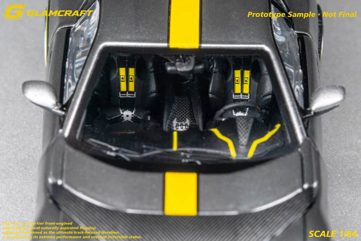 GLAMCRAFT 1:64 Ferrari 812 Competizione Grey with Yellow Stripe diecast model interior close-up with racing seats, yellow harnesses and detailed cockpit
