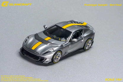 GLAMCRAFT 1:64 Ferrari 812 Competizione Grey with Yellow Stripe diecast model car front three-quarter view with carbon fiber details