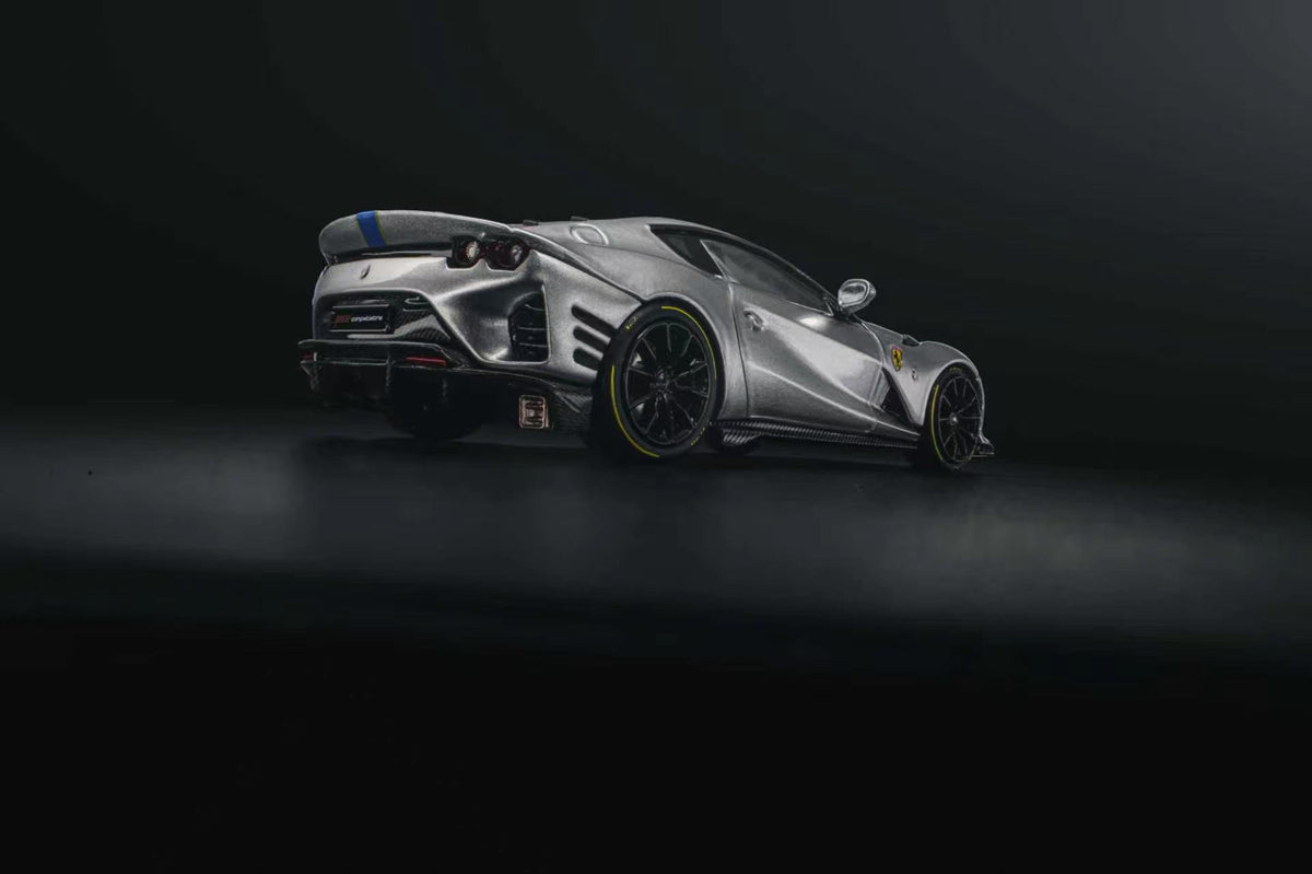 GLAMCRAFT 1:64 Ferrari 812 Competizione Silver with Blue Stripes diecast model car rear three-quarter view with carbon fiber details