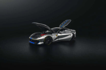 GLAMCRAFT 1:64 Ferrari 812 Competizione Silver with Blue Stripes diecast model with opening hood, door and rear hatch, front three-quarter view