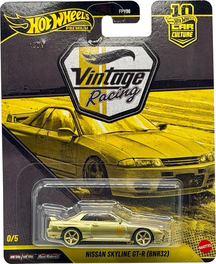 Hot Wheels Vintage Racing Nissan Skyline GT-R (BNR32) die-cast toy car in its original blister card packaging, featuring a yellow car graphic on a black and yellow card.