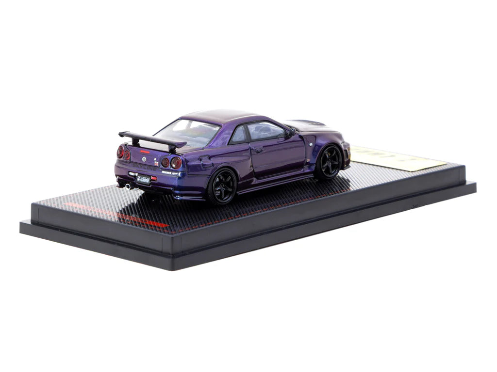 Model car on a display stand with a white background