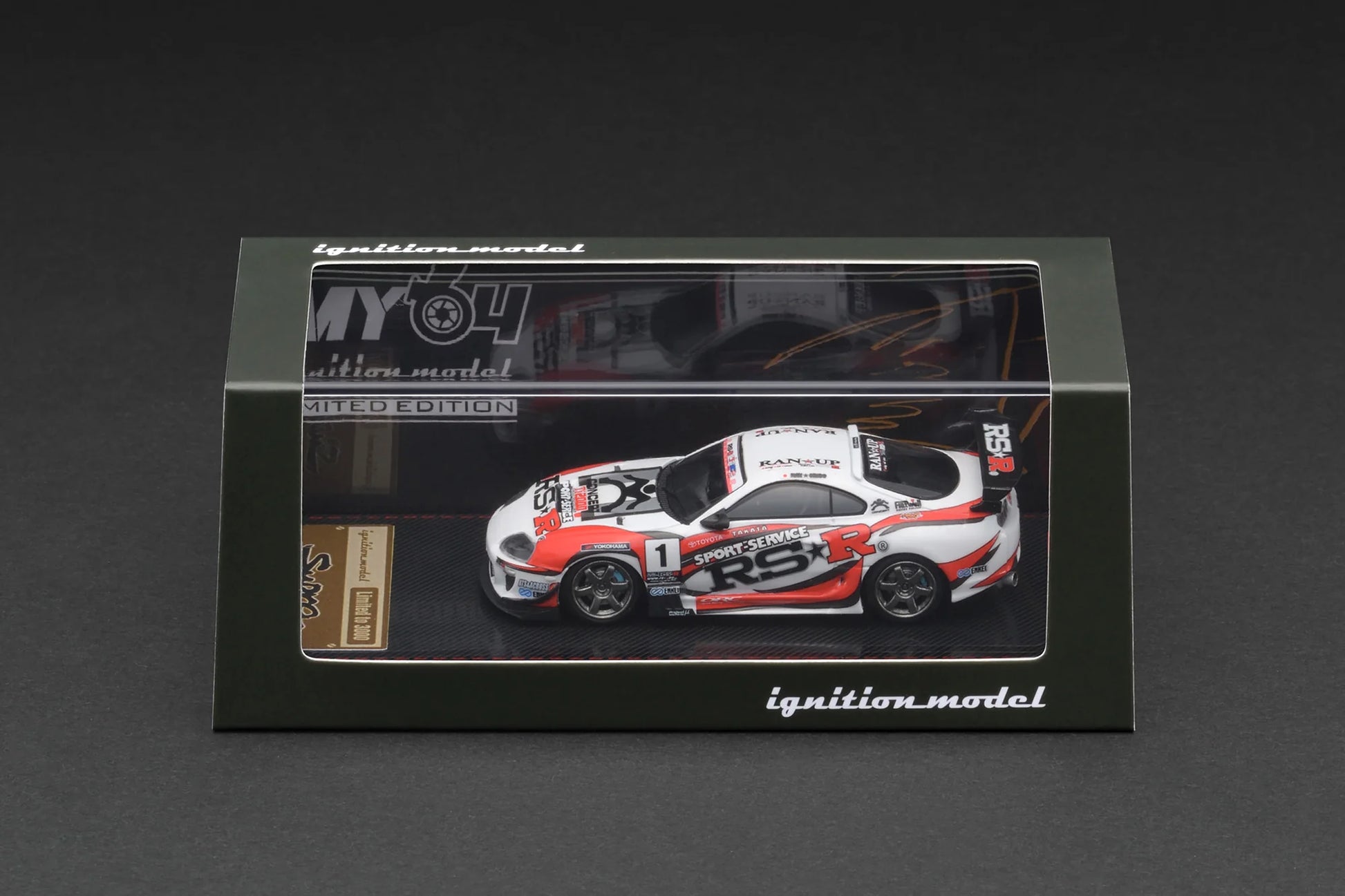 Model car in a clear display case with 'ignition model' branding on a dark background