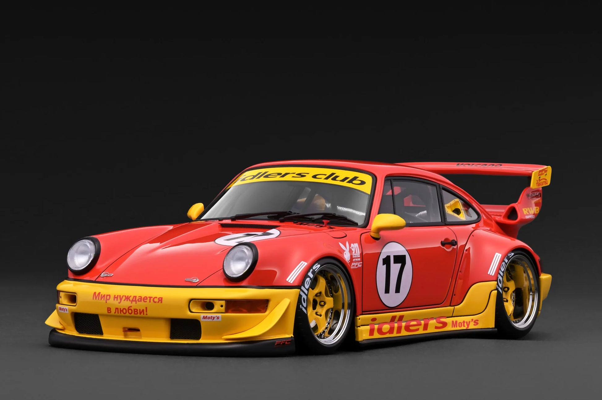 Red and yellow race car with visible branding on a dark background