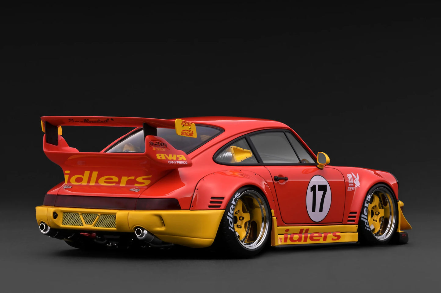 Red and yellow race car with visible branding on a dark background