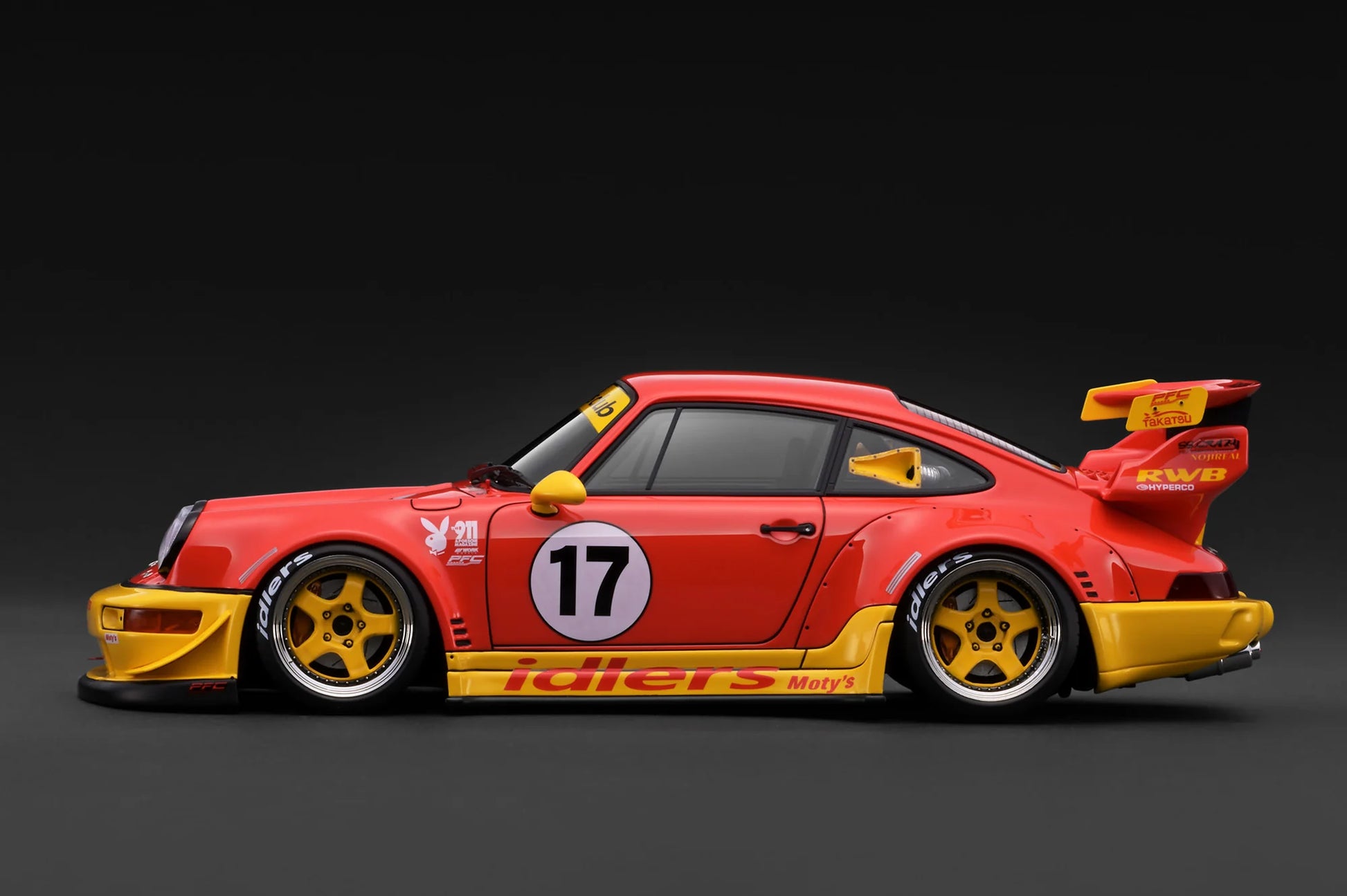 Red and yellow race car with number 17 on a dark background