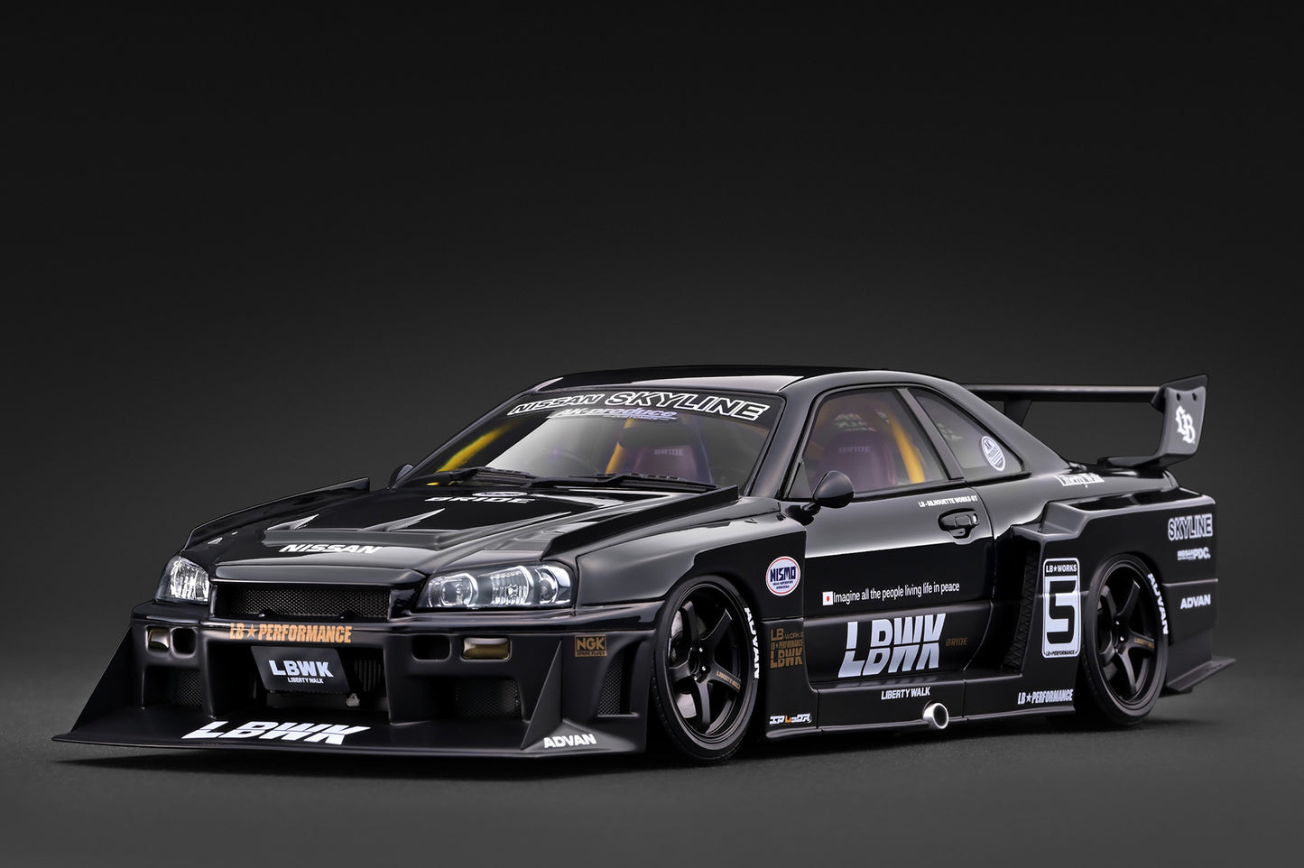 A black widebody race car model with white and silver sponsor decals, including LBW and Subaru, shown on a dark studio background.
