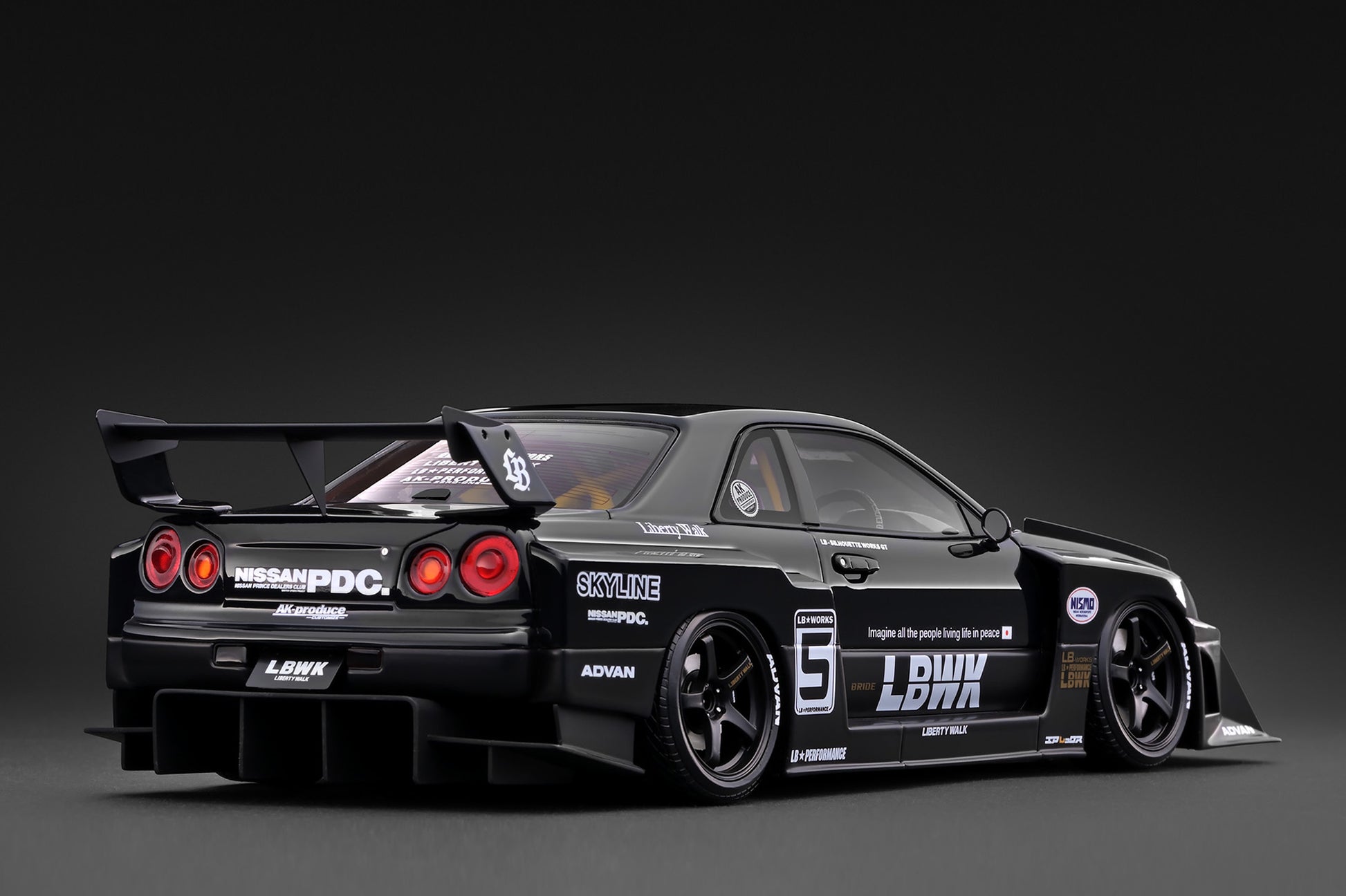 A black widebody sports car model with racing decals, including 'LBK', 'SKYLINE', and 'HESWAPDC', shown from a rear three-quarter angle against a dark studio background.