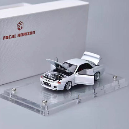 Model car on a display stand with 'Focal Horizon' branding in the background