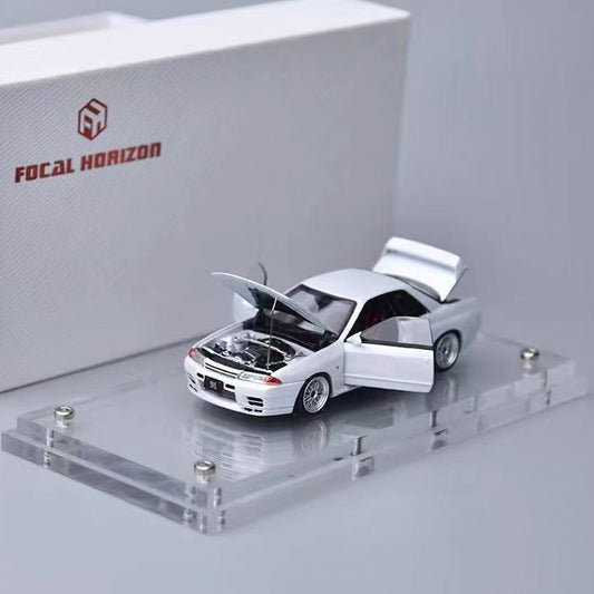 Model car on a display stand with 'Focal Horizon' branding in the background