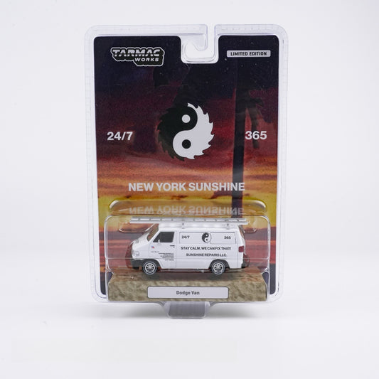 Model Dodge van in packaging with 'Tarmac Works' branding and sunset design.