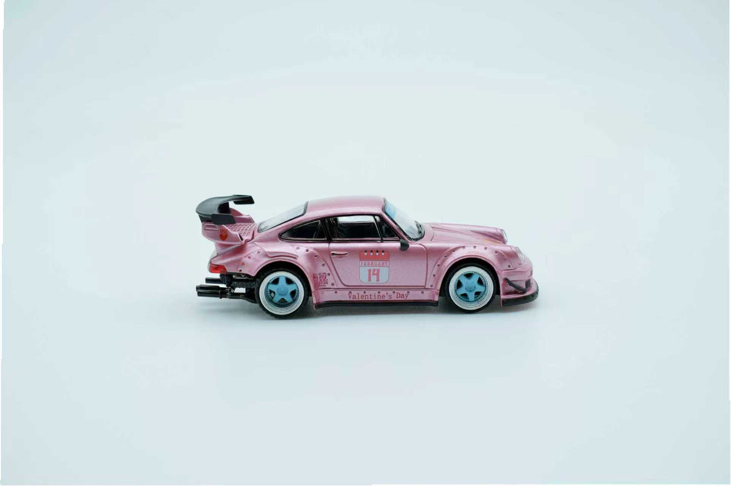 Pink toy car on a light gray background