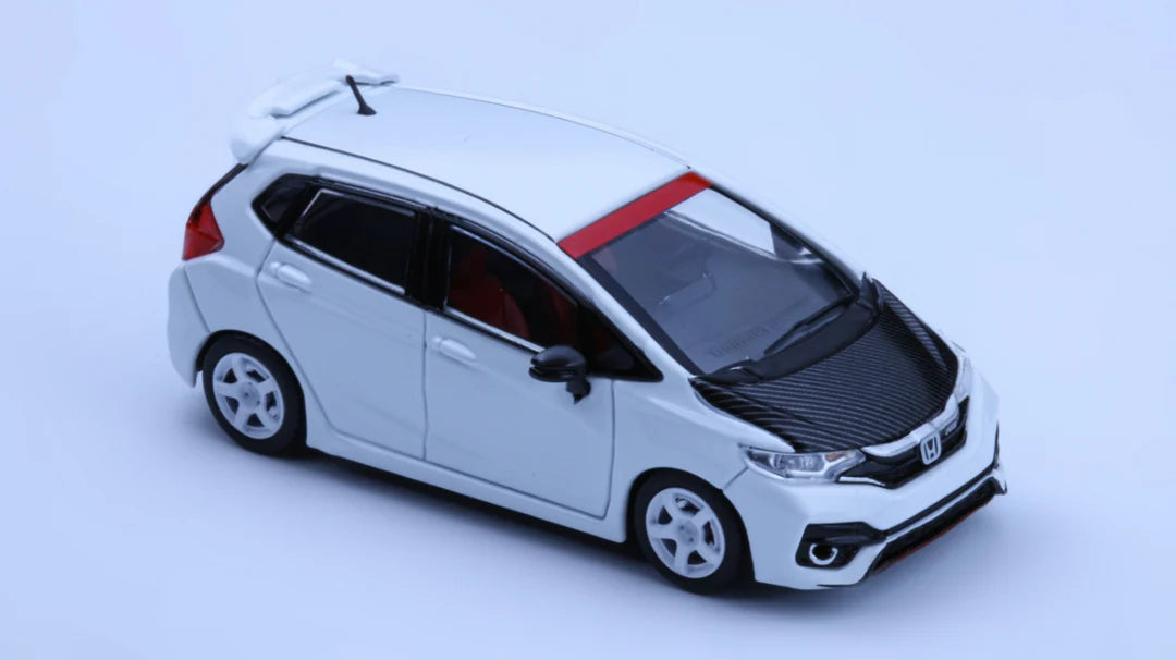Model of a white car with a red stripe on a light blue background