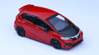 Red car model on a light blue background