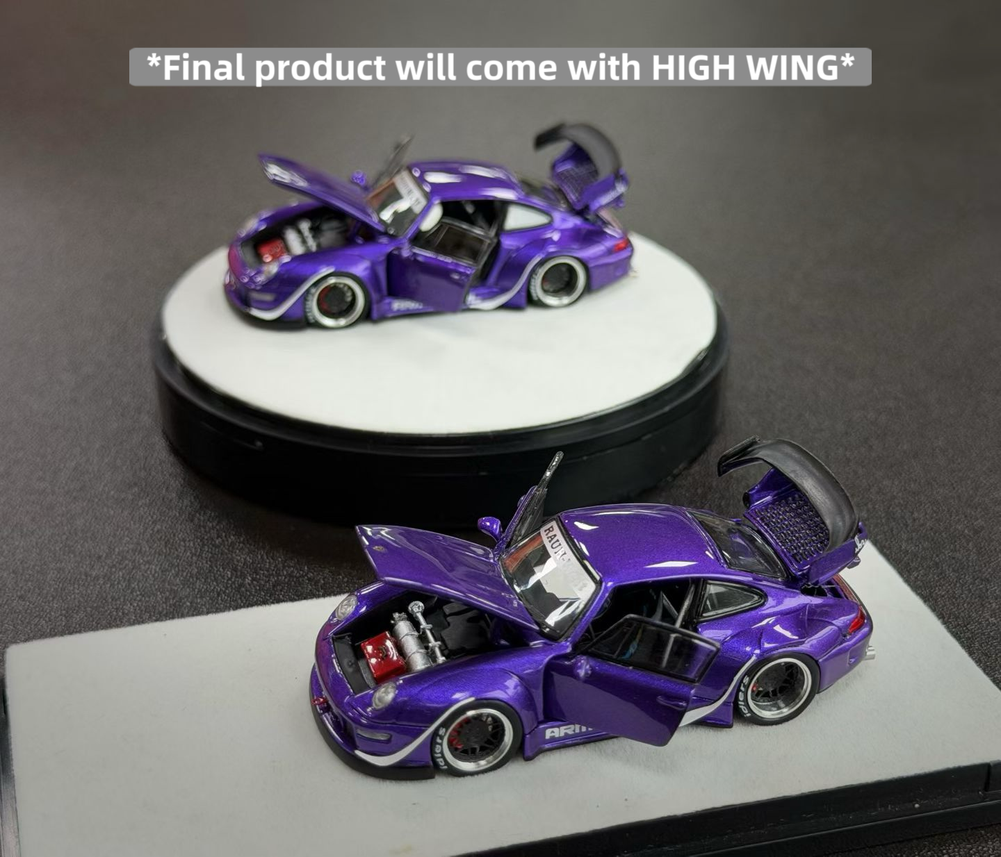 Two purple model cars on display with a text overlay indicating 'High Wing' feature.