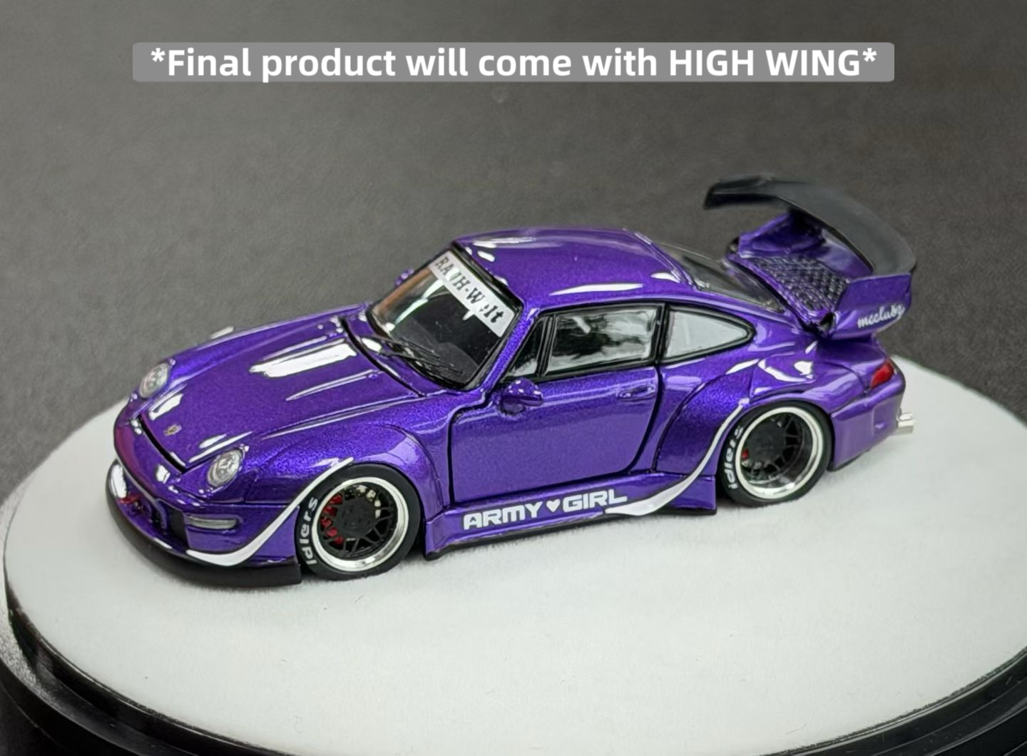 Purple model car with open roof on a gray background