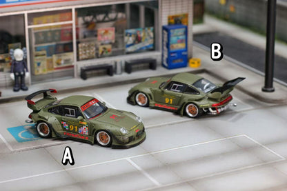 Two model cars on a miniature street setup with labeled parts.