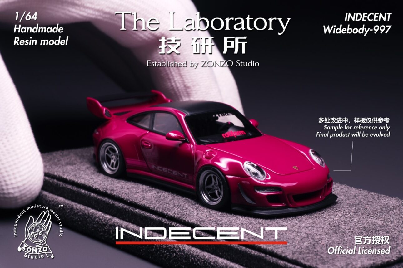 Model car of a pink sports car with 'The Laboratory' branding on a dark background